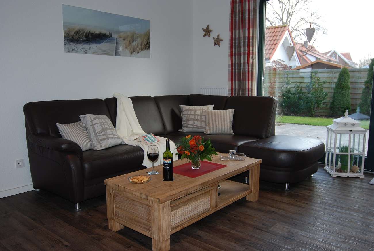 Wohnbereich mit Sitzgruppe –
        Ferienhaus Windvogel